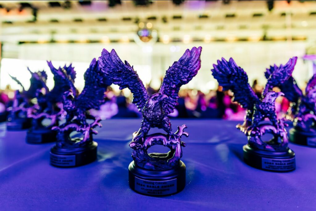 A group of Eagle Awards trophies set up on a table
